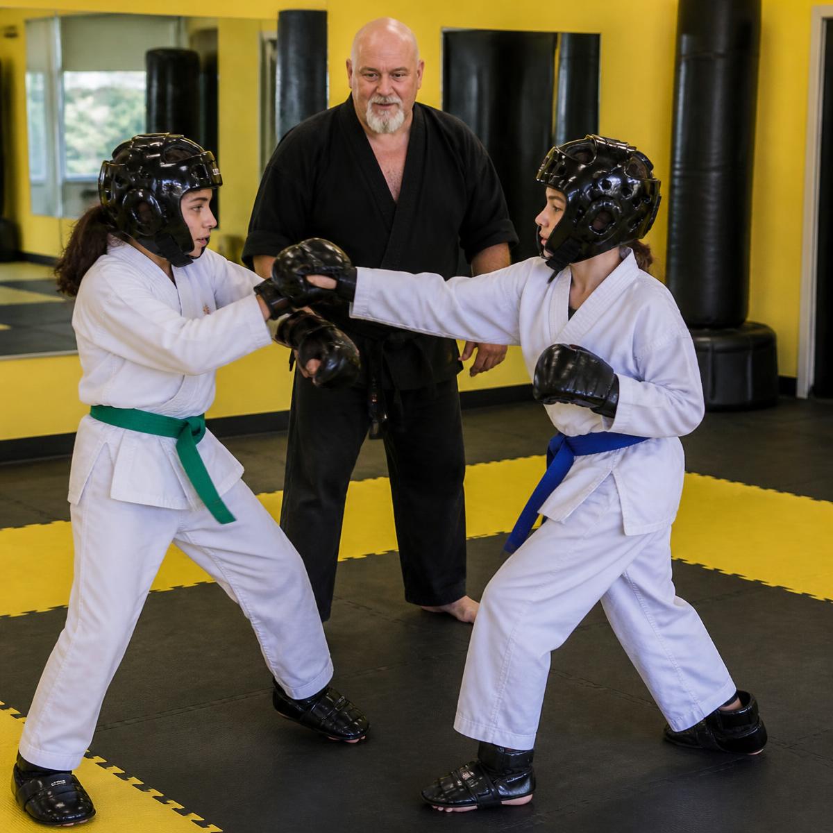 Extreme SKILLZ instructor coaching a student at Pride Martial Arts
